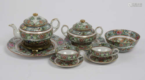 20th century Chinese tea service, painted with flowers and foliage, consisting of 12 teacups,