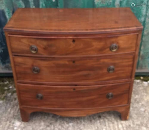 A 19th Century crossbanded mahogany bow-front chest-of-drawers, three graduated drawers, in two