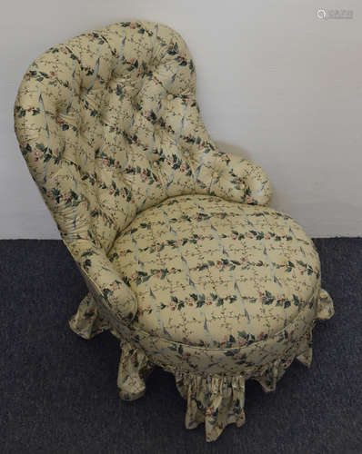 An Edwardian floral button backed nursing chair