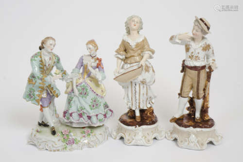 A pair of Meissen figurines, a woman holding a basket and a gentleman wearing a hat, dressed in
