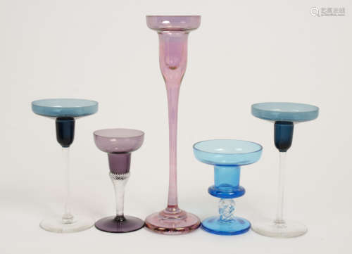 A small group of assorted saucer and pan topped candlesticks, one of heavy gauge in iridised pink,
