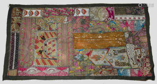 Indian wall hanging, decorated with hand and machine embroidery, beading and patchwork panels, 130 x