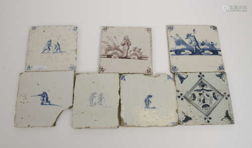 Seven late 18th or early 19th Century Delft tiles, seven painted in blue and one in purple, one of