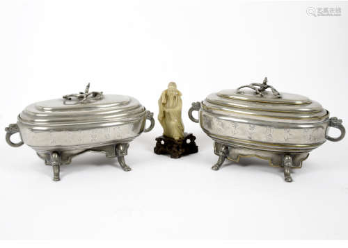 A pair of 19th Century Chinese white metal tureens and covers, dragon handles to tureens and covers,