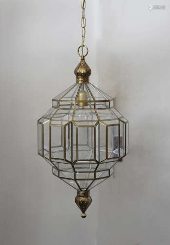 A contemporary Moroccan style faceted ovoid glass and brass hall lantern, 102 cm high