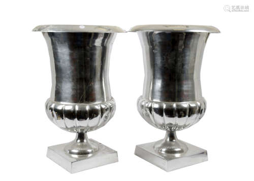 A pair of large modern aluminium planters, urn form, ribbed lower body on square base, 'Nic Duysens'