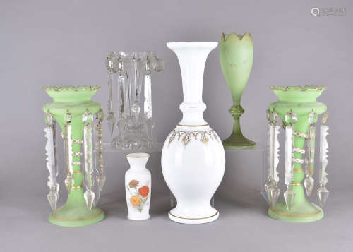A pair of Victorian green glass lustres, with white opaque serpent and colourless prism drops,