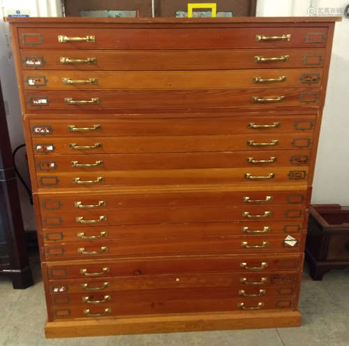 A 20th Century pine four tier plan chest, brass handles, four drawers to each section, 152 cm wide x