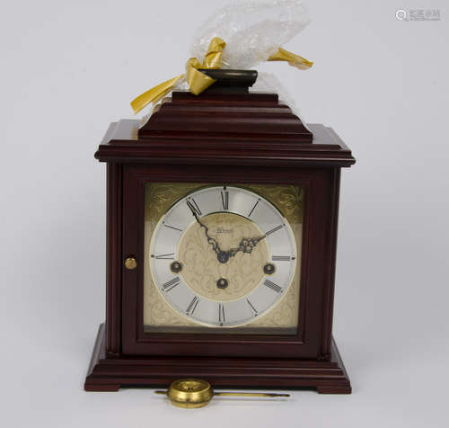 Contemporary German mahogany mantel clock, moulded top with brass carrying handle, 15 cm square