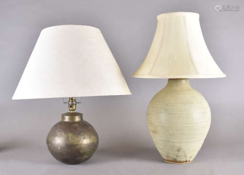 A stoneware ovoid table lamp, 33 cm high, tapered cream shade. Together with an Indian brass