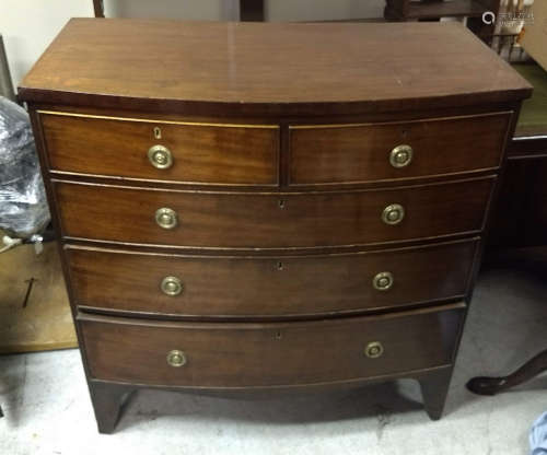 An antique mahogany bow-front chest-of-drawers, two short over three graduated long drawers,