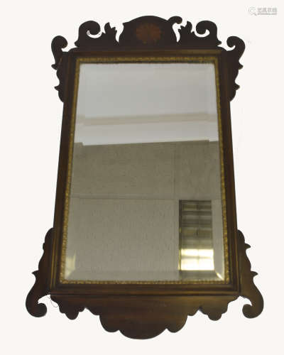 A 19th Century mahogany inlaid fret carved mirror, bevelled plate, gilt slip, 39.5 cm wide x 65.5 cm