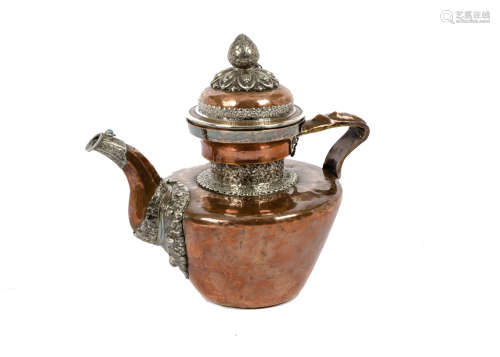 A late 19th Century Tibetan copper and silver teapot, domed cover with lotus bud final, applied