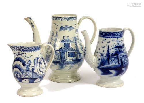Two 18th century pearlware coffee pots, hand painted in under glaze blue with a pagodas, on circular