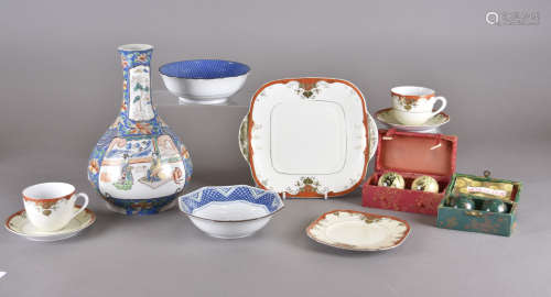 A Meito Japan part tea set with red and gilt borders and gilt scroll decoration on ivory ground,