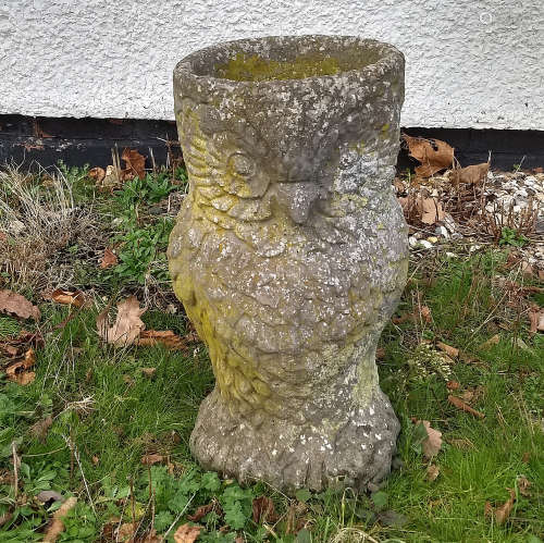 A stone planter in the form of an owl, 50 cm high