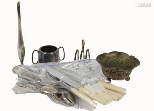 A selection of 20th Century silver tableware, including a toast rack, napkin rings and sugar