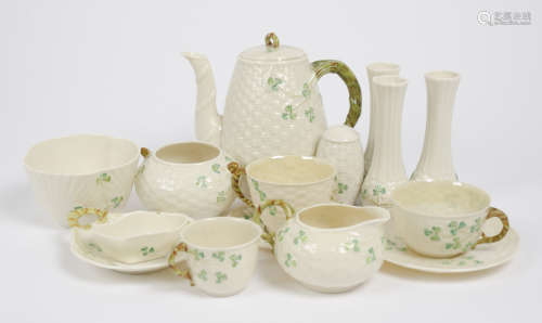 A large collection of Belleek porcelain, with shamrock and clover decoration, including a coffee