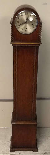 A 20th Century oak cased grandmother clock by Enfield, circular dial, Arabic numerals, two barley-