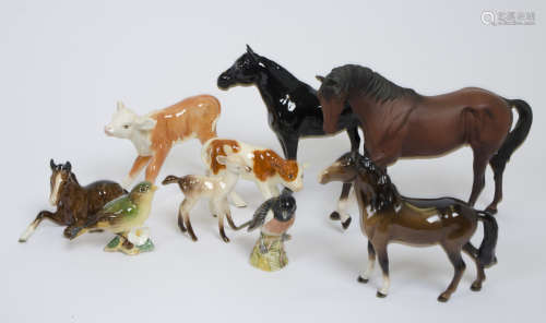 A collection of Beswick ceramic animals, comprising four horses, two calves, a fawn, and two finches