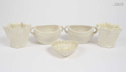 A collection of Belleek porcelain, mostly 1st and 2nd period, comprising two shell form vases, two