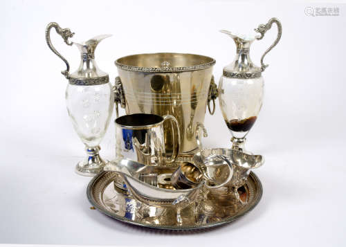 A quantity of silver plate and white metal, including a twin lion mask handled champagne bucket, a