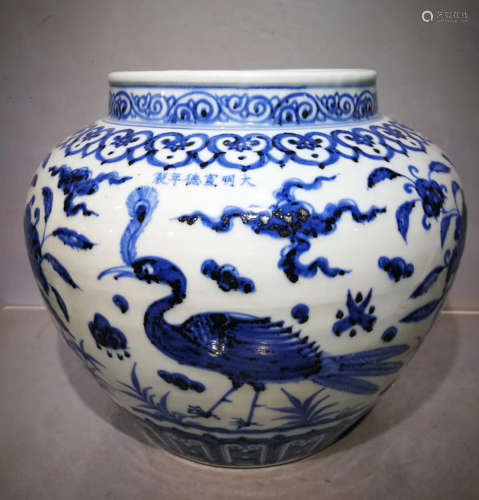A BLUE AND WHITE PEACOCK PATTERN JAR