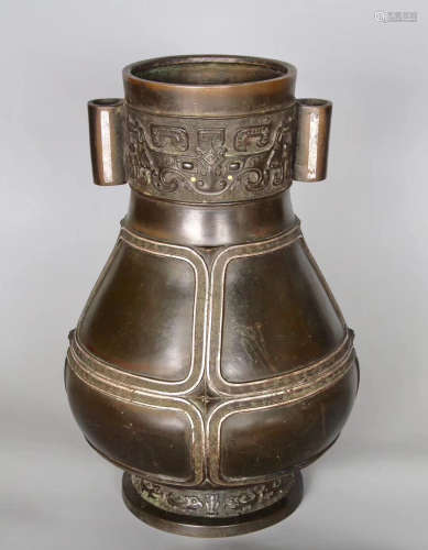 A BRONZE CASTED GILT SILVER BEAST PATTERN VASE