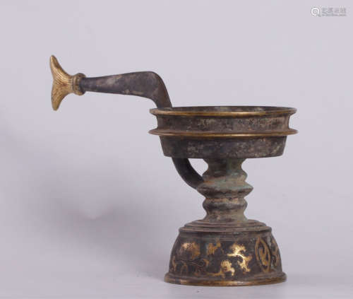 A SILVER CASTED GHEE LAMP HOLDER