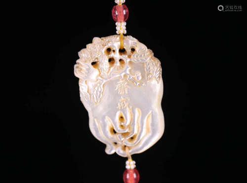 A SHELL CARVED PENDANT