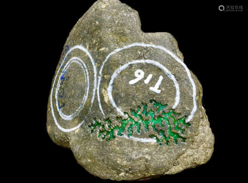 A BURMESE GREEN JADEITE STONE, A CLASS