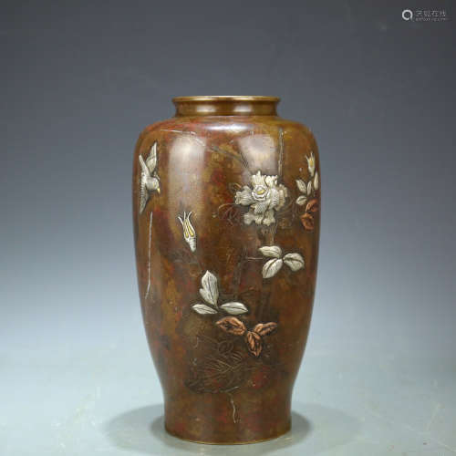 A FLORAL PATTERN COPPER BOTTLE VASE