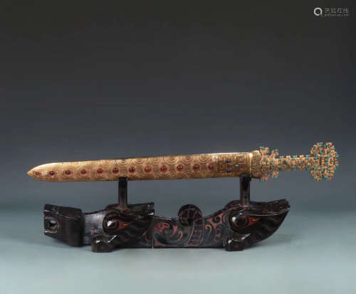 A GILT COPPER SWORD WITH GEM STONES DECORATION