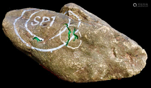 A BURMESE GREEN JADEITE STONE, A CLASS