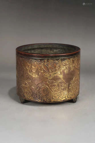 A GILT BRONZE LOTUS PATTERN POT DESIGN THREE-FOOT FURNACE