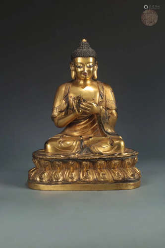 A GILT BRONZE BUDDHA DESIGN FIGURE