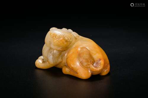 A White Jade Carving of An Animal