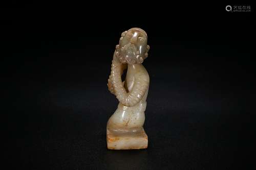 A White Jade Carving of A Figure