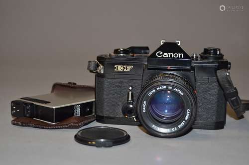 A Canon EF SLR Camera, black, serial no 420334, with a Canon FD 50mm f/1.4 lens, shutter working,