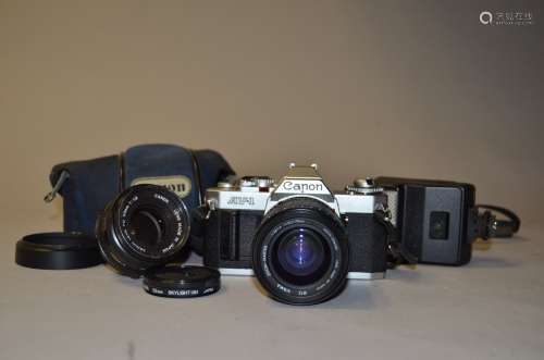 A Canon AV-1 SLR Camera, serial no 493272, shutter working, with a Canon FD 50mm f/1.8 lens and a