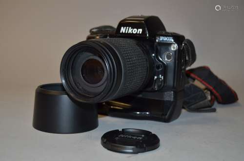 A Nikon F90X SLR Camera, serial no 2003687, condition F, sickiness at back near battery grip MB-