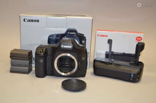 A Canon 5D DSLR Body, serial no 0930709568, condition G, shutter working, with battery grip BG-E4,