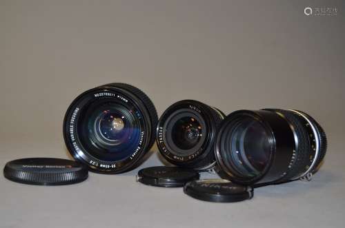 Two Nikon Nikkor Lenses, a Nikkor 24mm f/2.8 wide angle lens, no 763265, a Nikkor 135mm f/2.8 tele