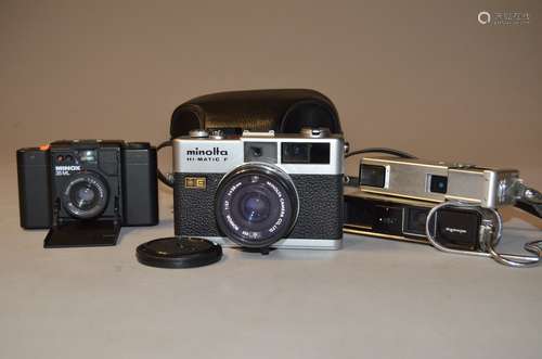 A Group of Compact Film Cameras, a Minolta Hi-Matic F rangefinder camera, serial no 1195453, with