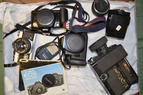 An Olympus OM-2 MD SLR Camera and Canon EOS Bodies, serial no 400811, shutter working with a Zuiko