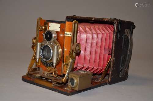 A Sanderson Regular Model Hand and Stand Folding Plate Camera, red bellows, serial no 13684, 3¼