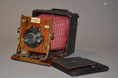 A Sanderson Regular Model Hand and Stand Folding Plate Camera, red bellows, 3¼ x 4¼,