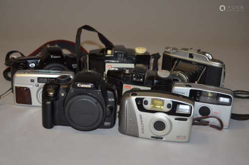 A Canon EOS 350D DSLR Camera Body, shutter working, side socket cover missing, together with a Canon