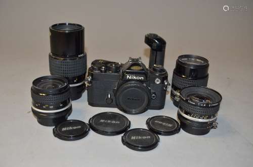 A Group of Nikon Nikkor AI Lenses and a Nikon FE SLR Body, a Nikkor 20mm f/2.8 lens, a Nikkor 24mm