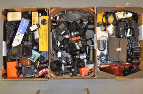 A Large Quantity of Small Accessories, including lens hoods, teleconverters, flashguns, table